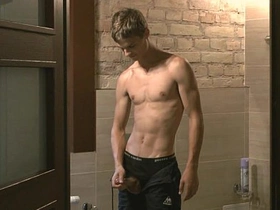 A young gay boy has a solo pleasure session in his home.