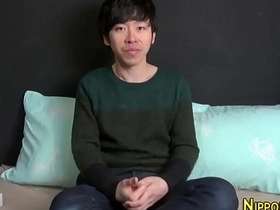 Young Asian man masturbates in the shower.