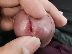 A young Asian boy shows off his small penis.