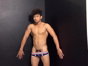 Young Asian boy gets into some trouble during a photoshoot.
