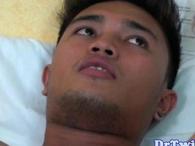 Oriental teen receives enema and toys his tight hole